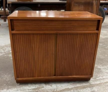 Mid-Century Modern credenzas like these are often up for bidding on HiBid.com.