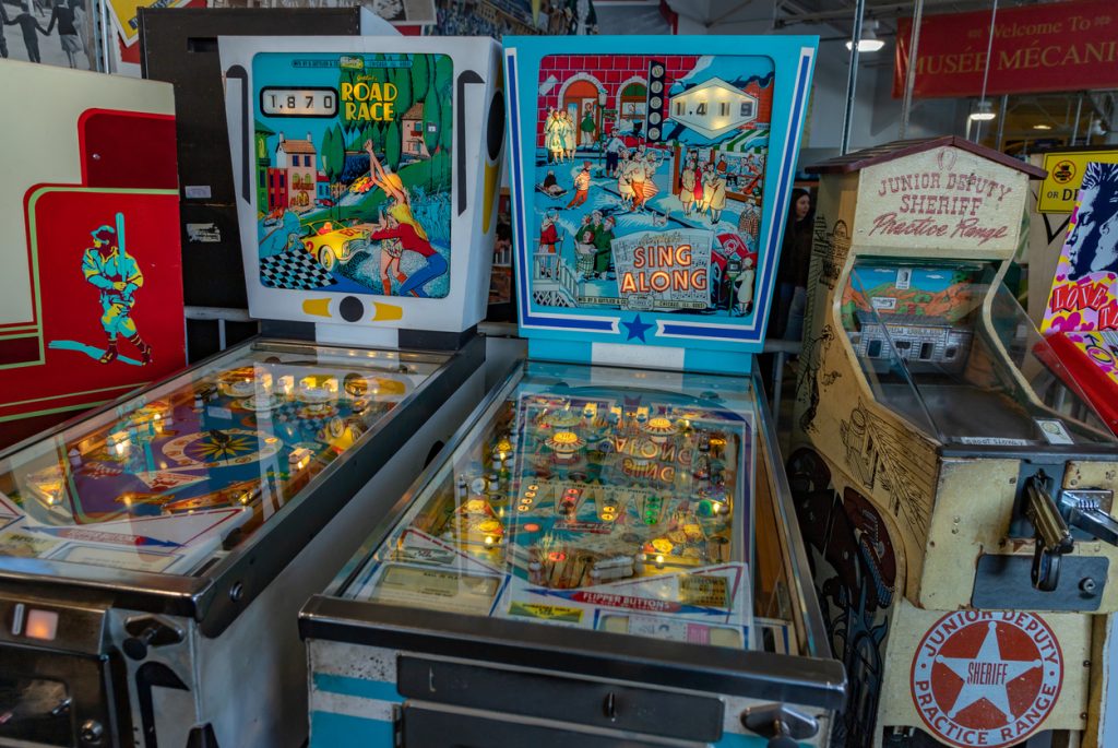 Retro pinball machines in an arcade.