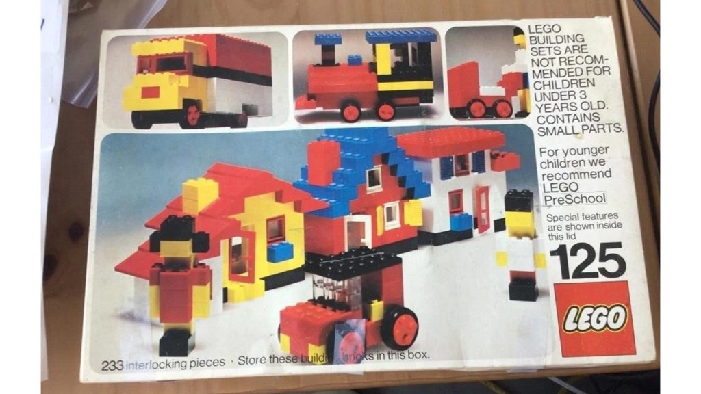 A decades-old box of LEGO building bricks in good condition.