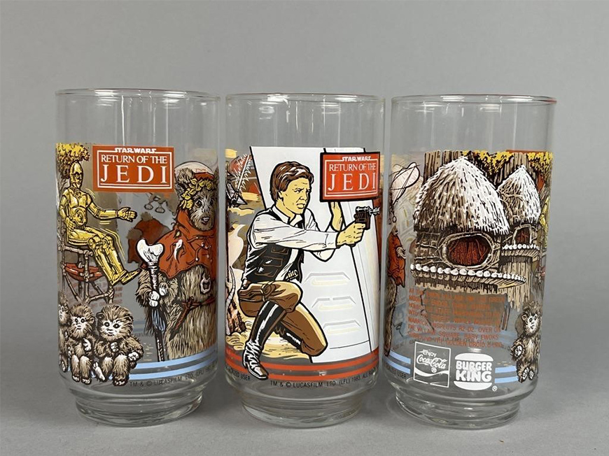Three glass cups with Burger King branding depict scenes from “Star Wars: Return of the Jedi.”