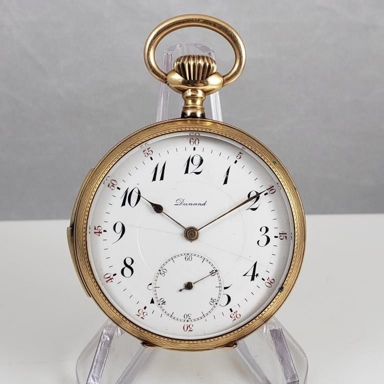 Swiss "Dunand" 14K gold 1/4 repeater pocket watch on display.