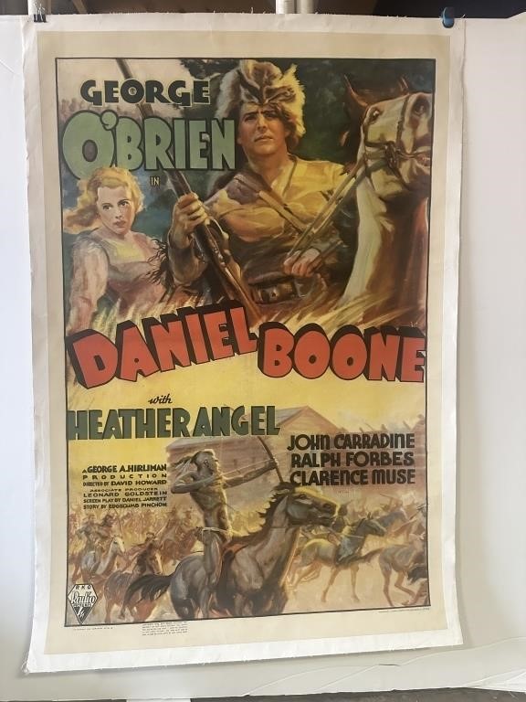 A movie poster with red and green text promoting the film “Daniel Boone.”