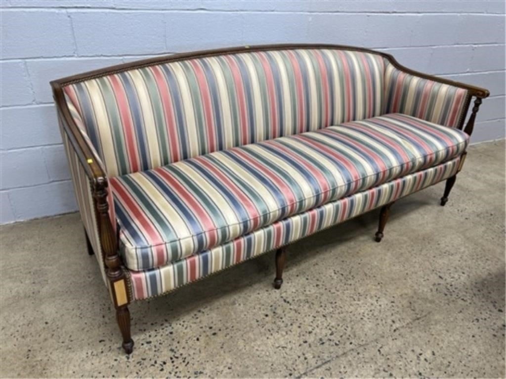 A Damask striped upholstered sofa.