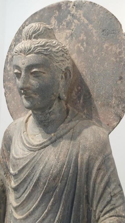 A rare 3rd Century Antique Gandhara Buddha carving available for bidding on the online auction platform HiBid.com. 